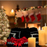 Christmas backdrop will a folded Alpaca blanket with red bow as a gift.